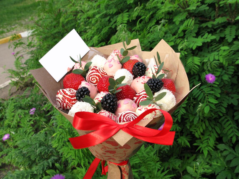 A chocolate flower bouquet with strawberries and blackberries 