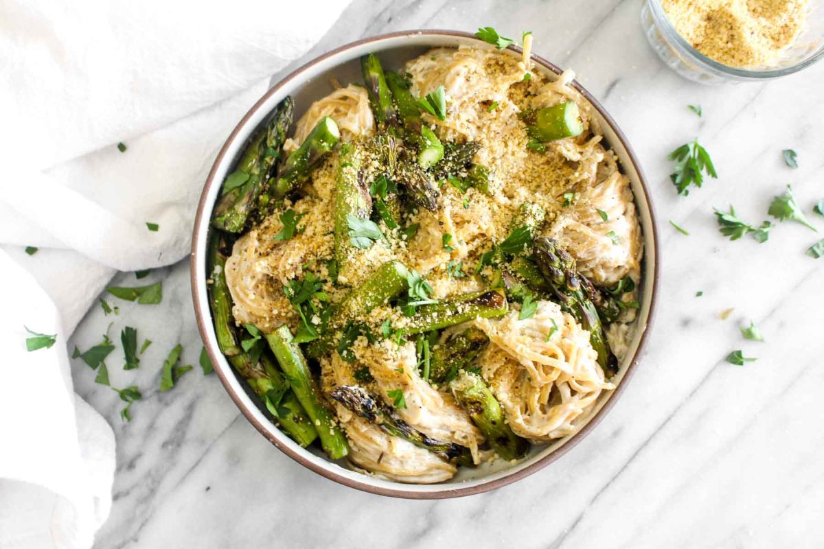 Vegan alfredo pasta with grilled asparagus pot of water