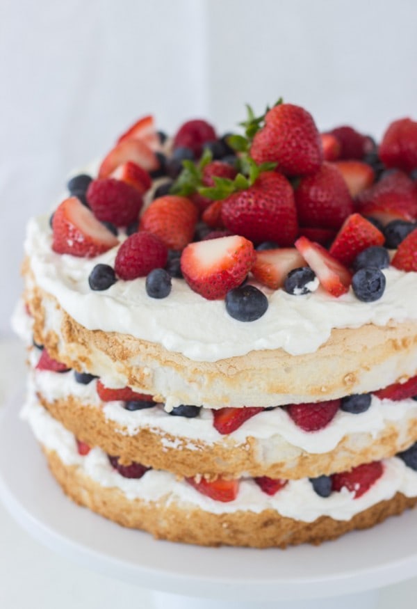Angel food cake with coconut whipped cream and berries 1 600×875