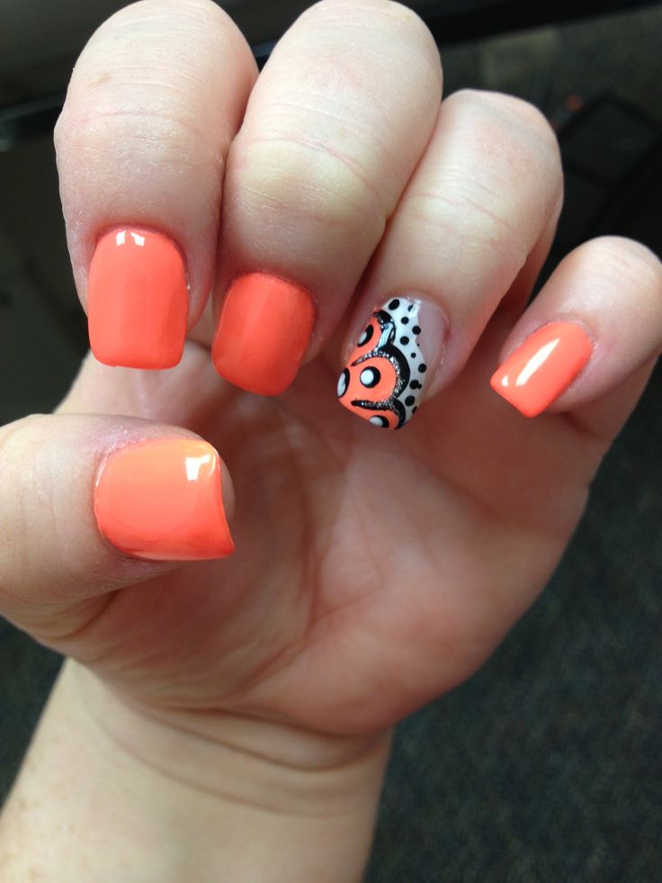 Neon orange with an orange paisley accent nail