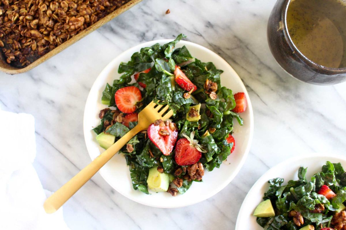 Strawberry avocado kale salad with savory granola top