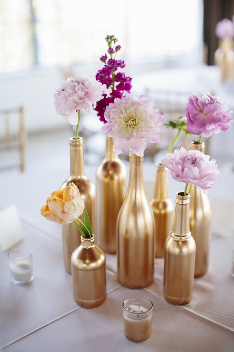 Gold painted bottles centerpiece diy