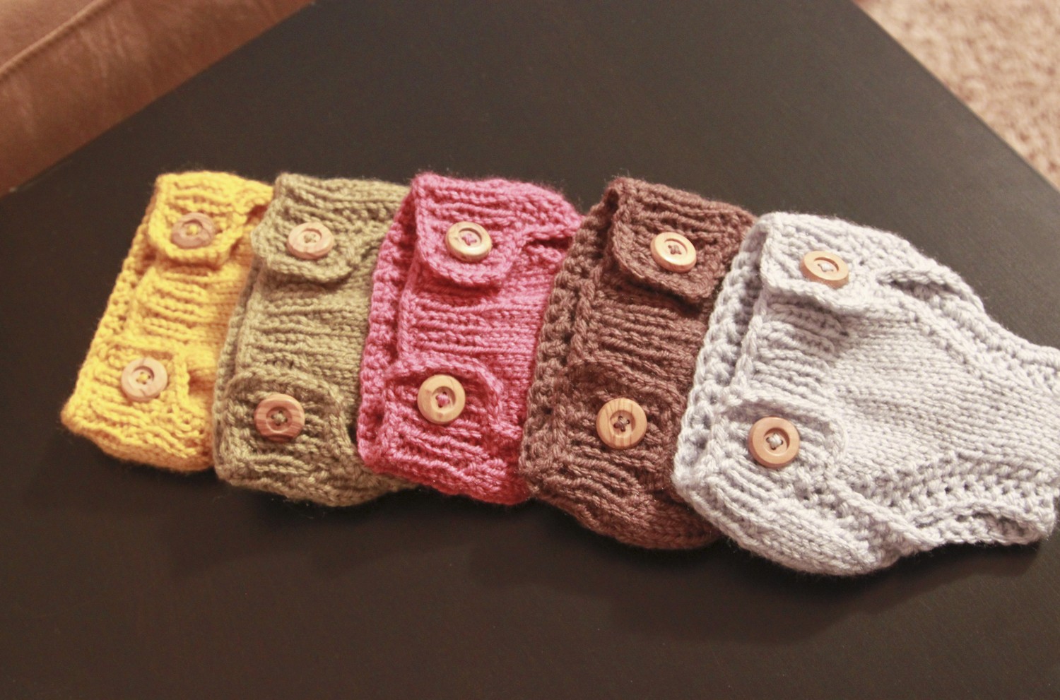 Wooden buttoned newborn covers