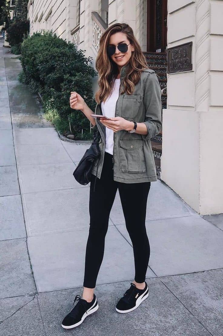 Military jacket and tights with sneakers concert outfit idea
