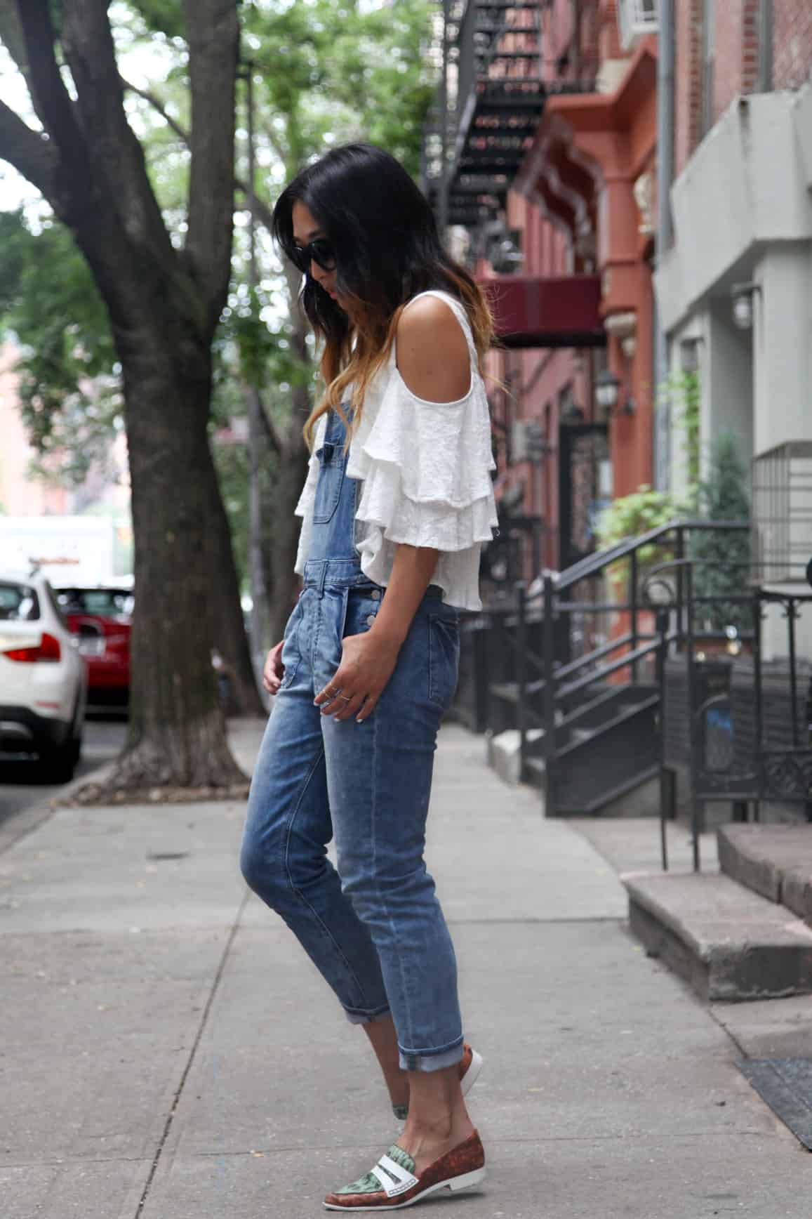 Overalls and ruffled blouse concert outfit idea