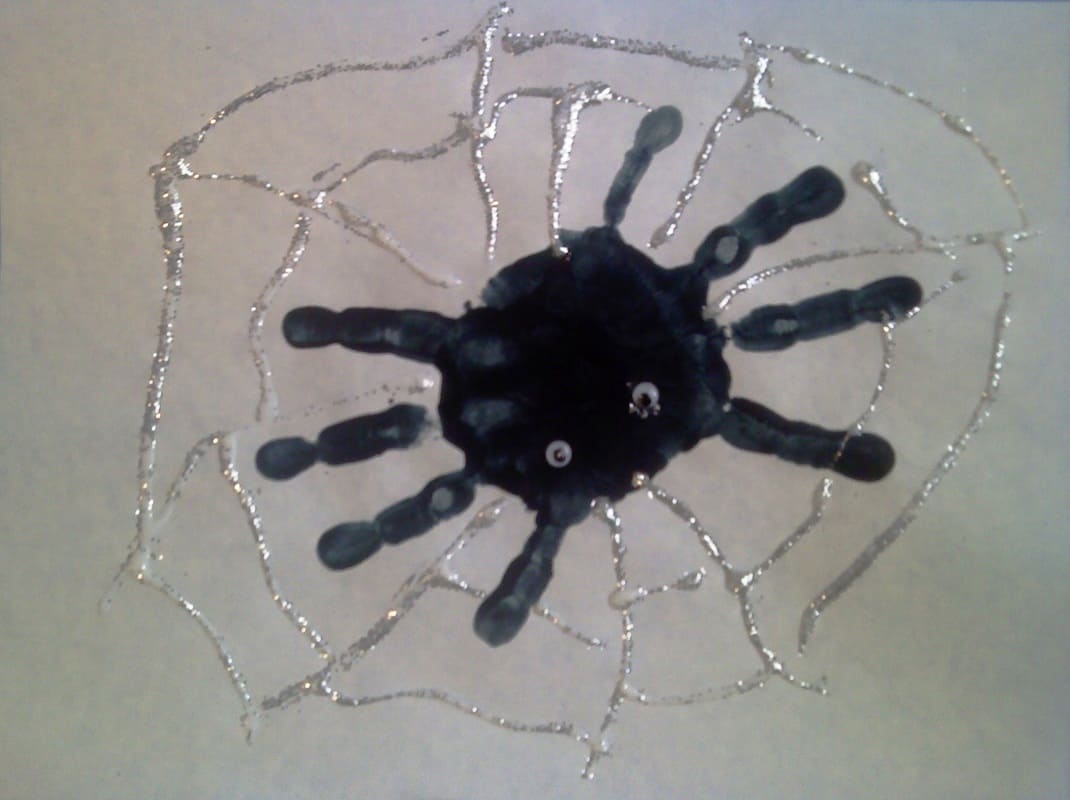 Handprint spider with glitter glue web