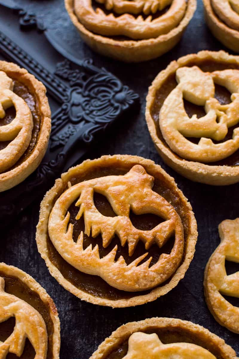 Halloween Jack-O-Lantern pumpkin pies - impress your guests with these spooky treats!