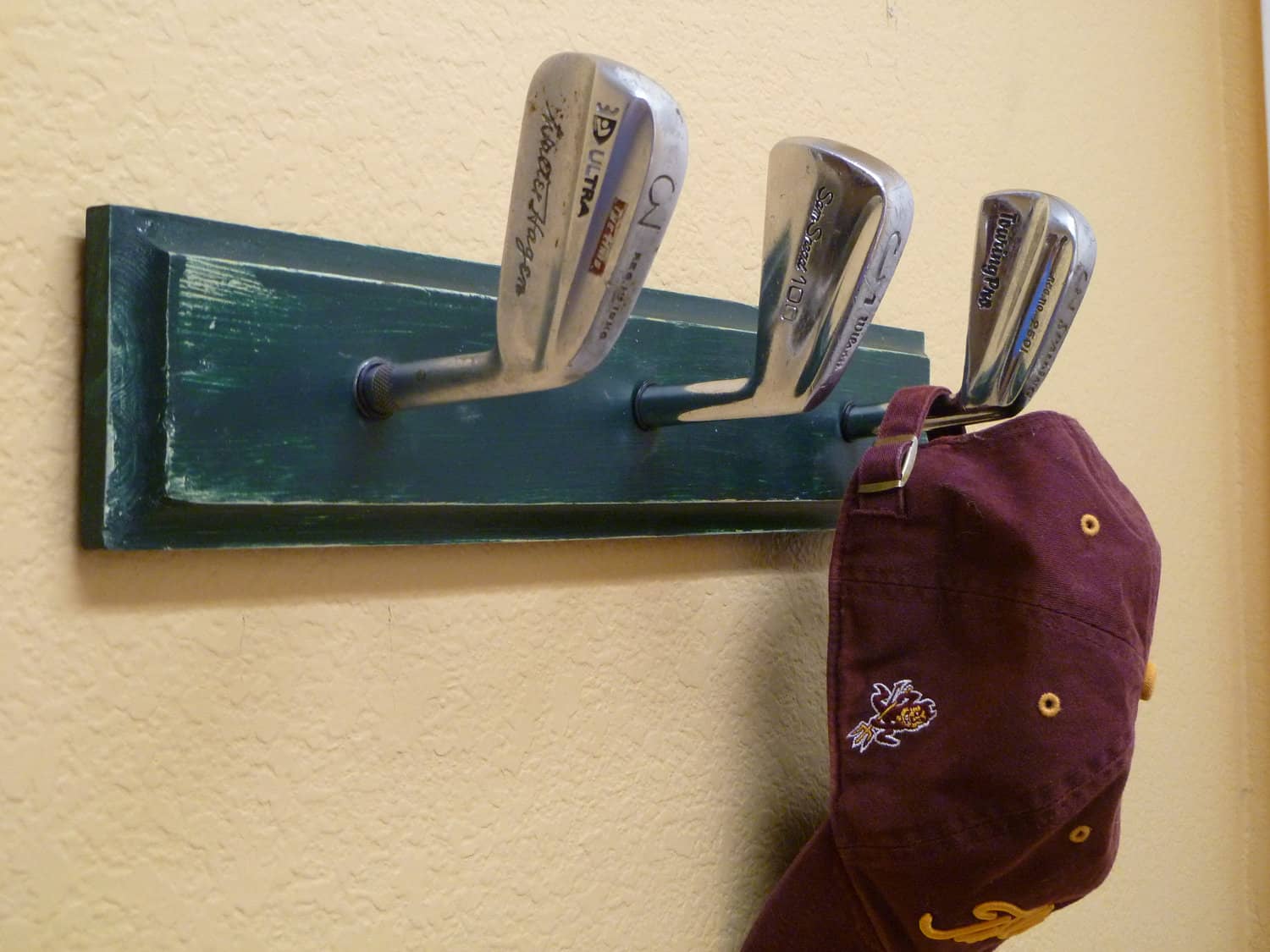 Golf club head coat rack