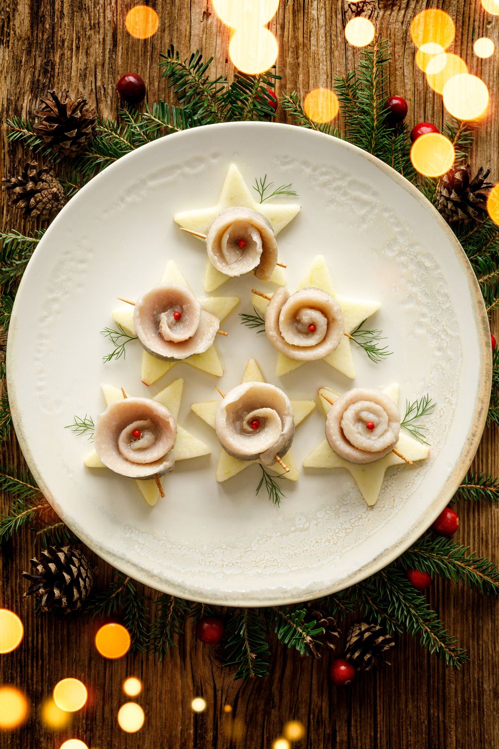 Herring fillets on star shaped cheese christmas eve appetizers