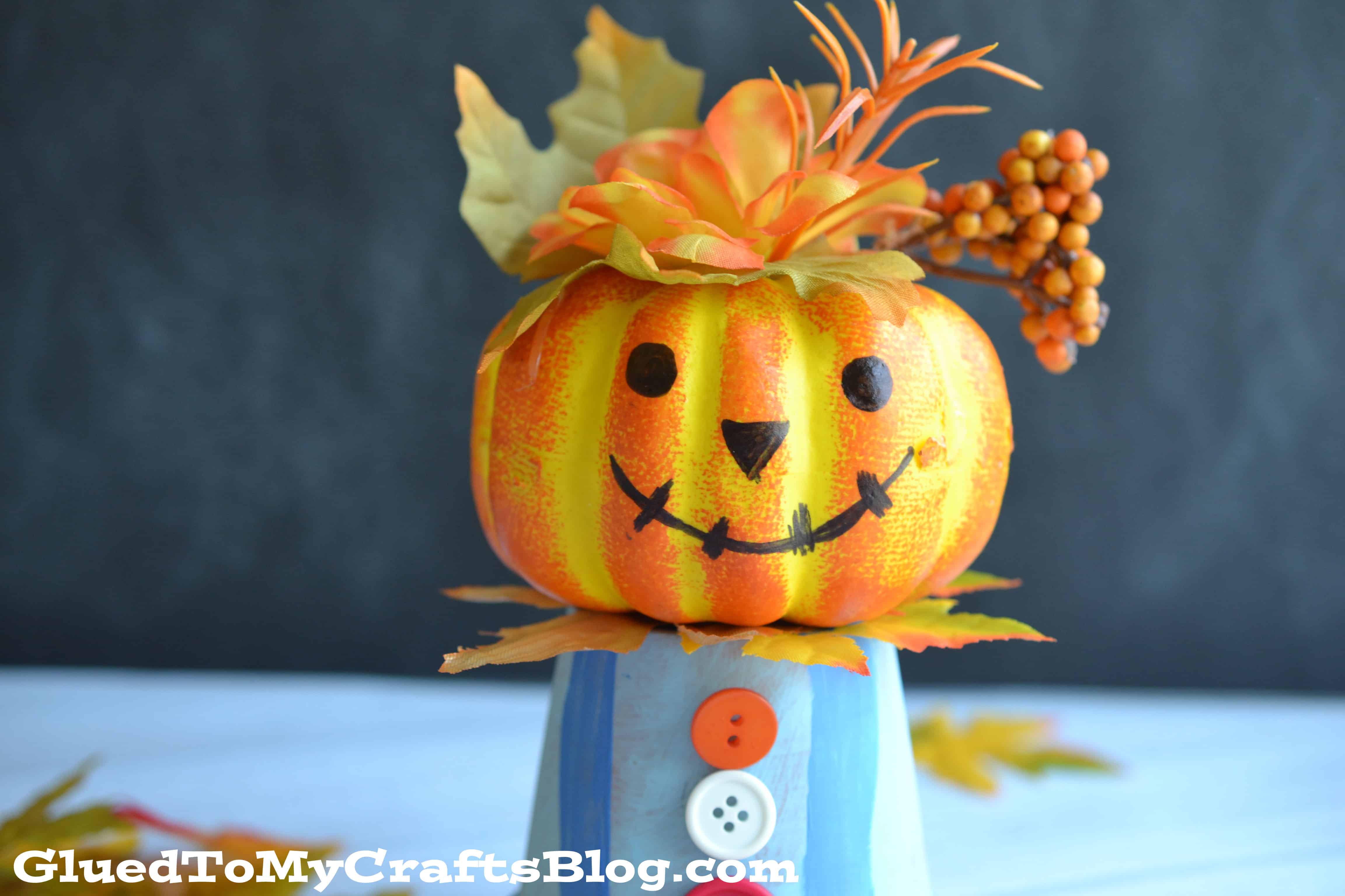 Mini pumpkin and buttons scarecrow