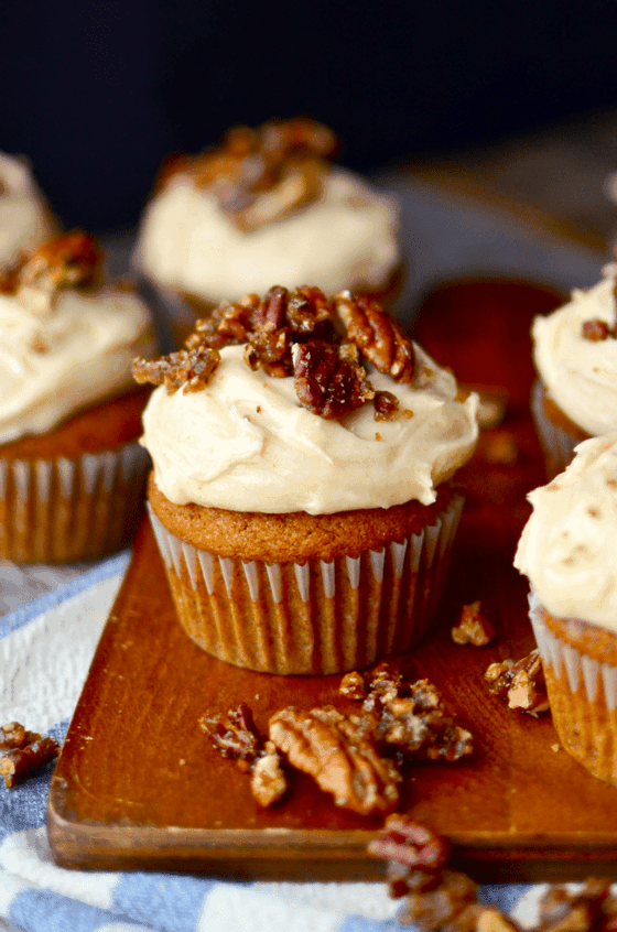 Pumpkin cupcakes with browned butter cream cheese frosting and candied pecans