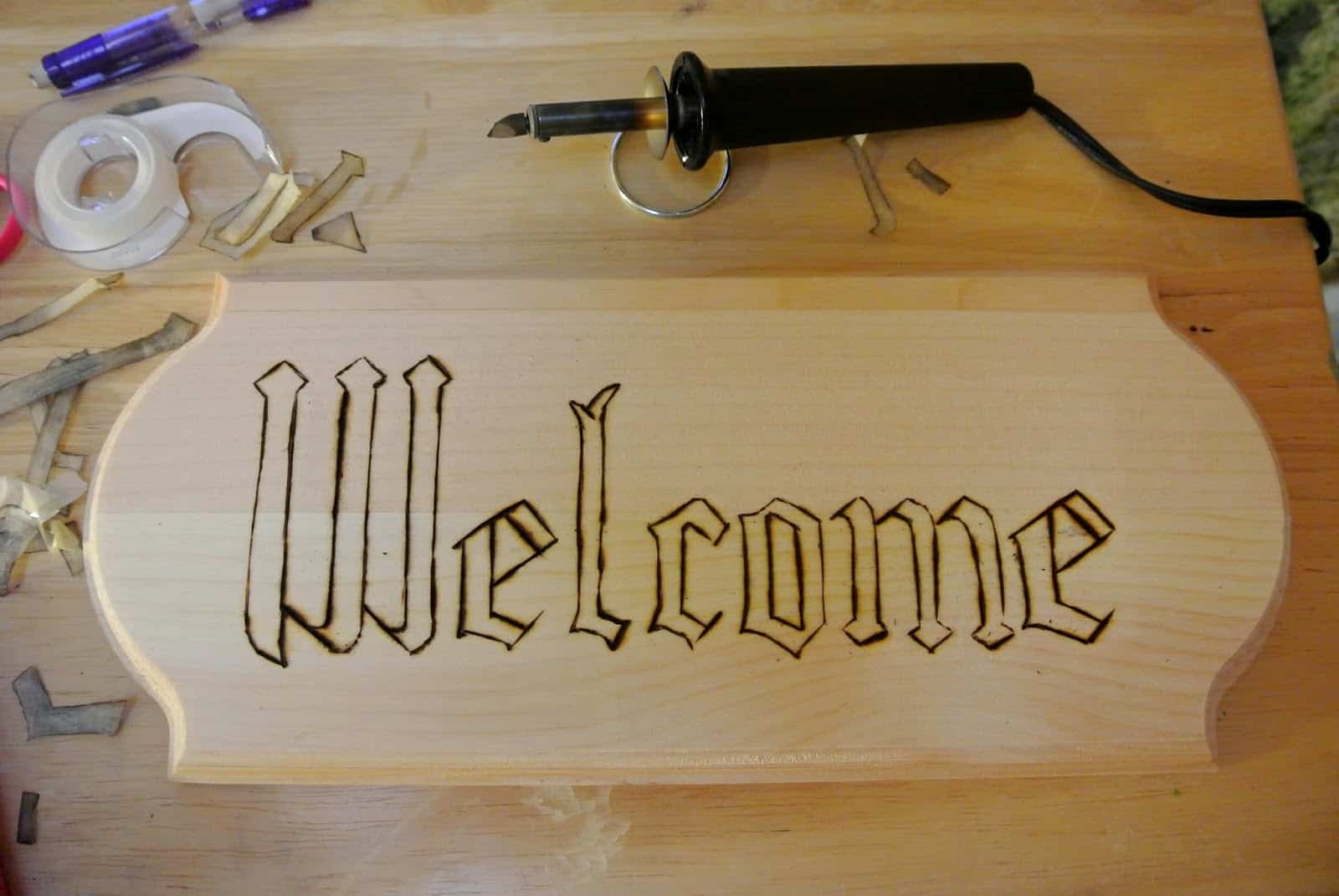 Wood burned welcome sign