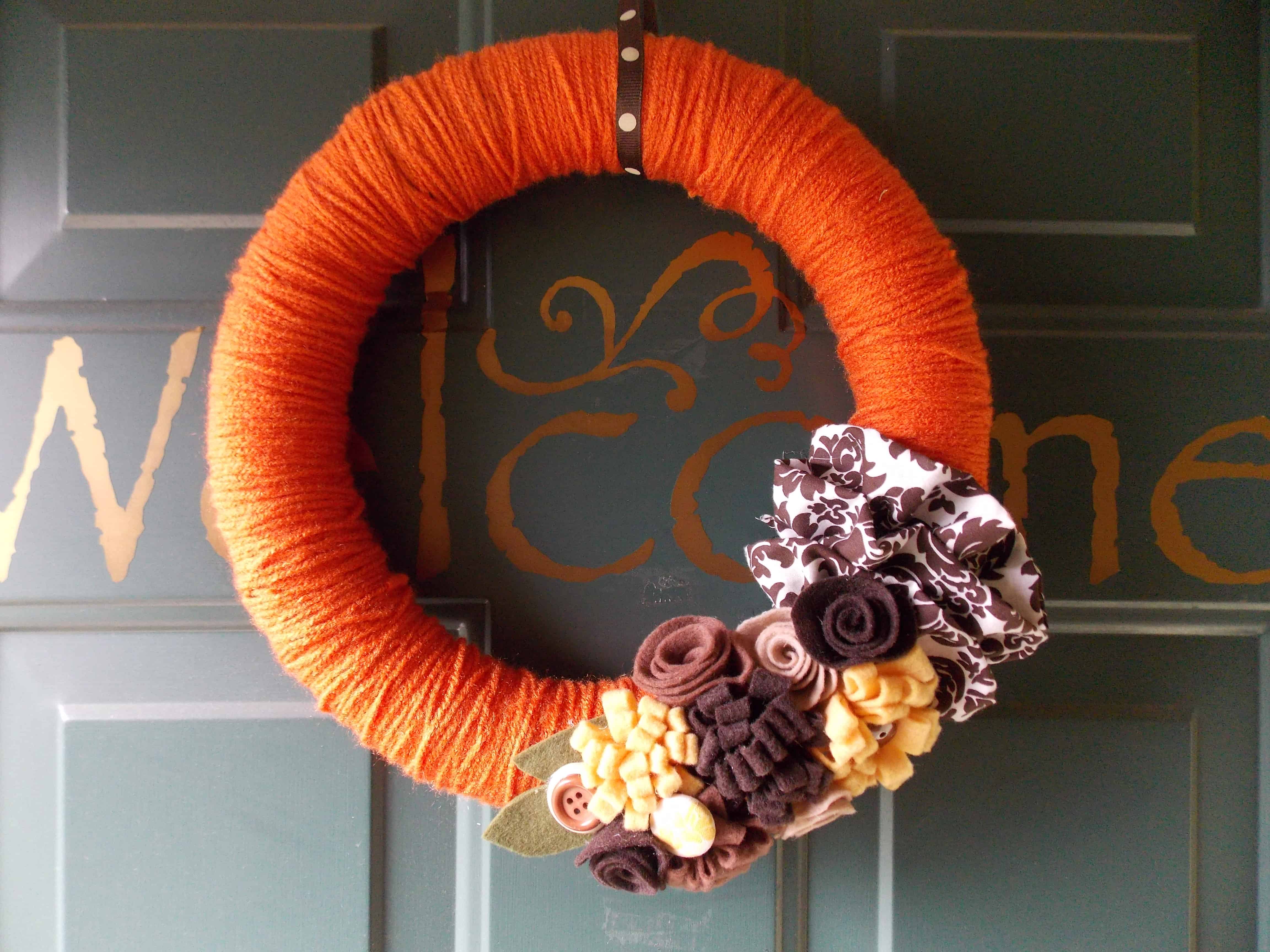 Yarn wrapped wreath with felt flowers