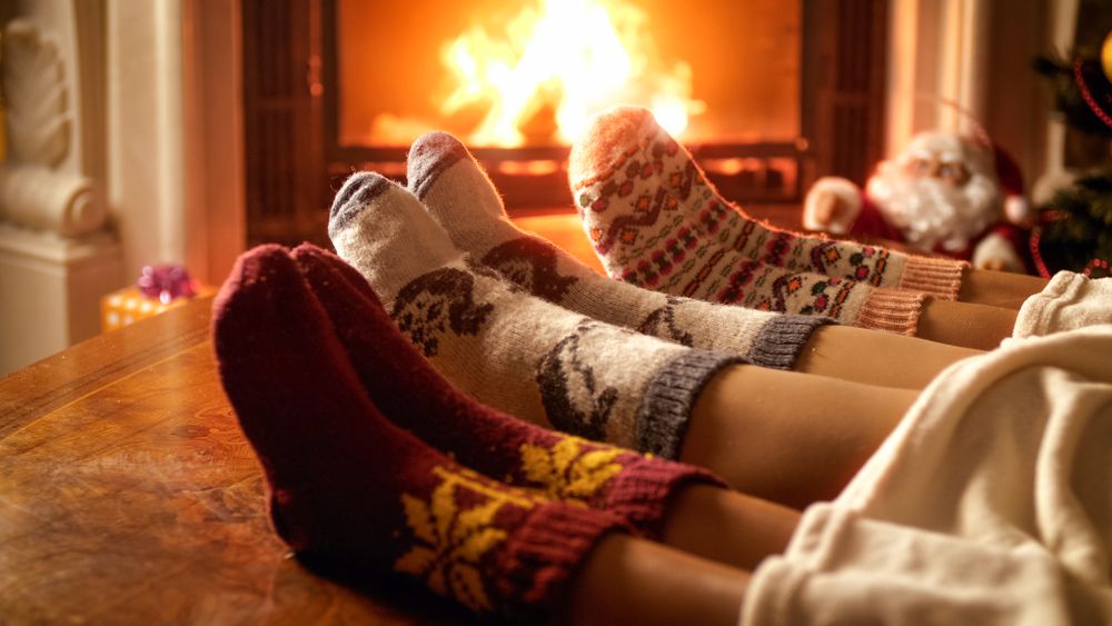 Funny family christmas photos socks by the fire