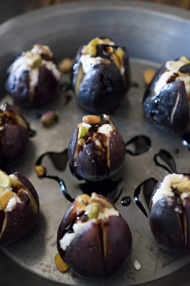 Warm figs with goat cheese, pistachios, and balsamic glaze