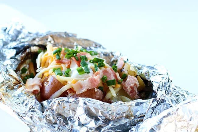 Campfire grilled loaded baked potatoes