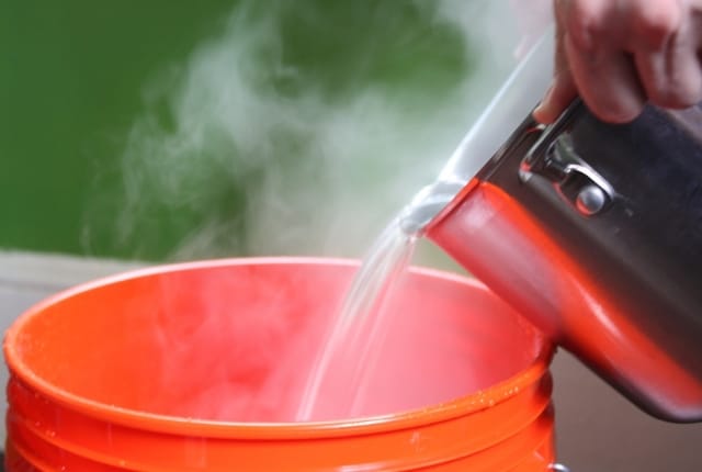 Boiling water and detergent for burnt pans