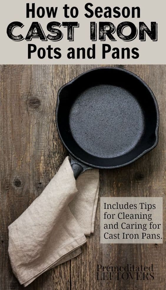 Empty cast iron pan on the old wooden background