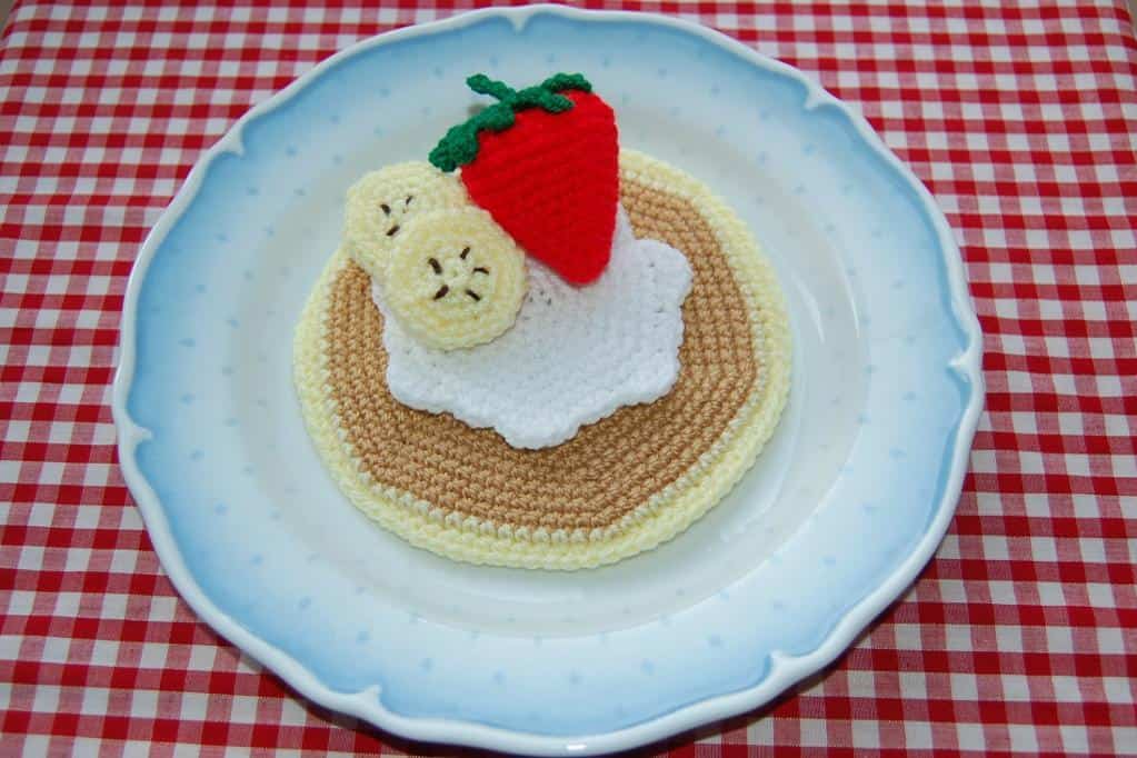 Crocheted fruit topped pancakes