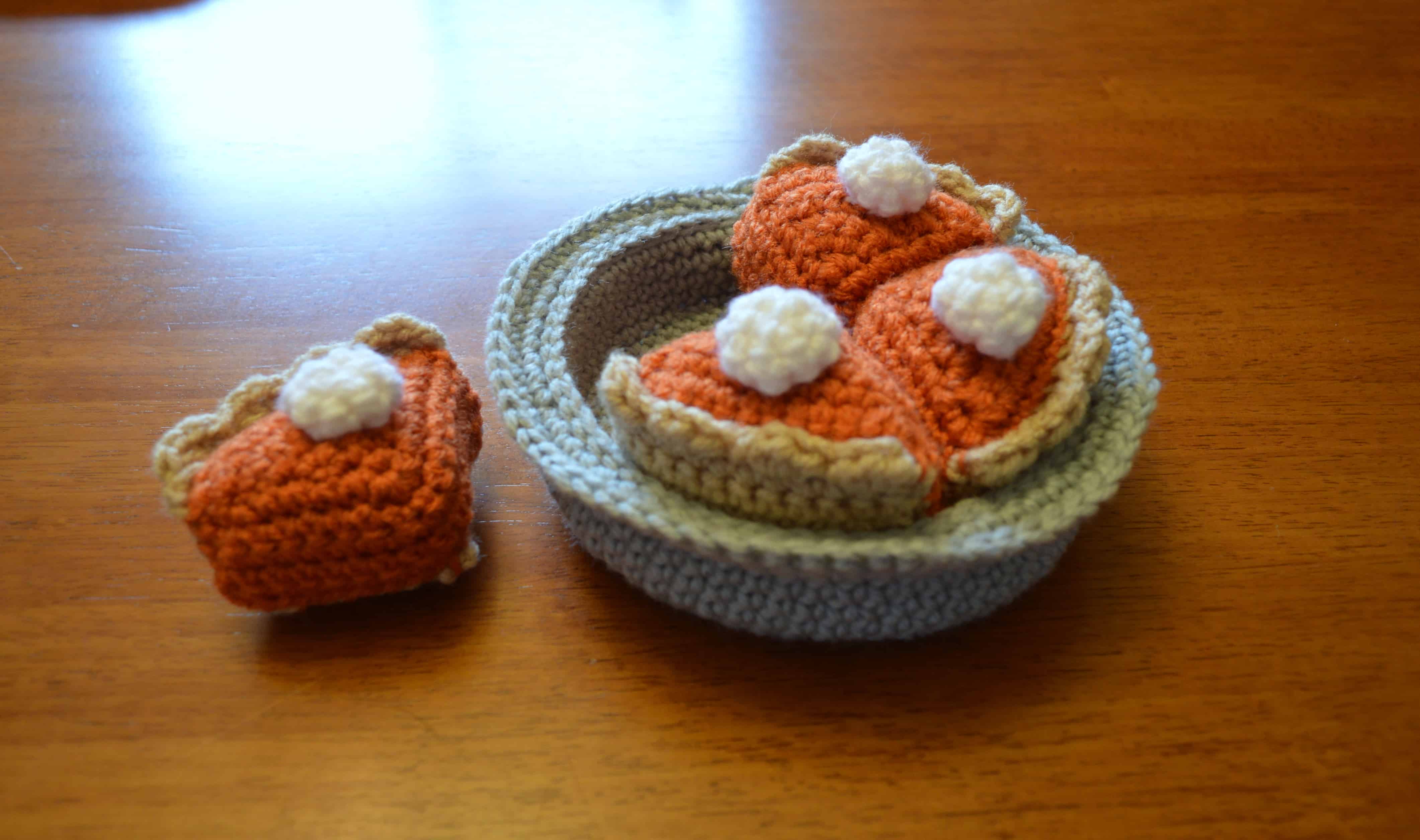 Crocheted pumpkin pie with pieces