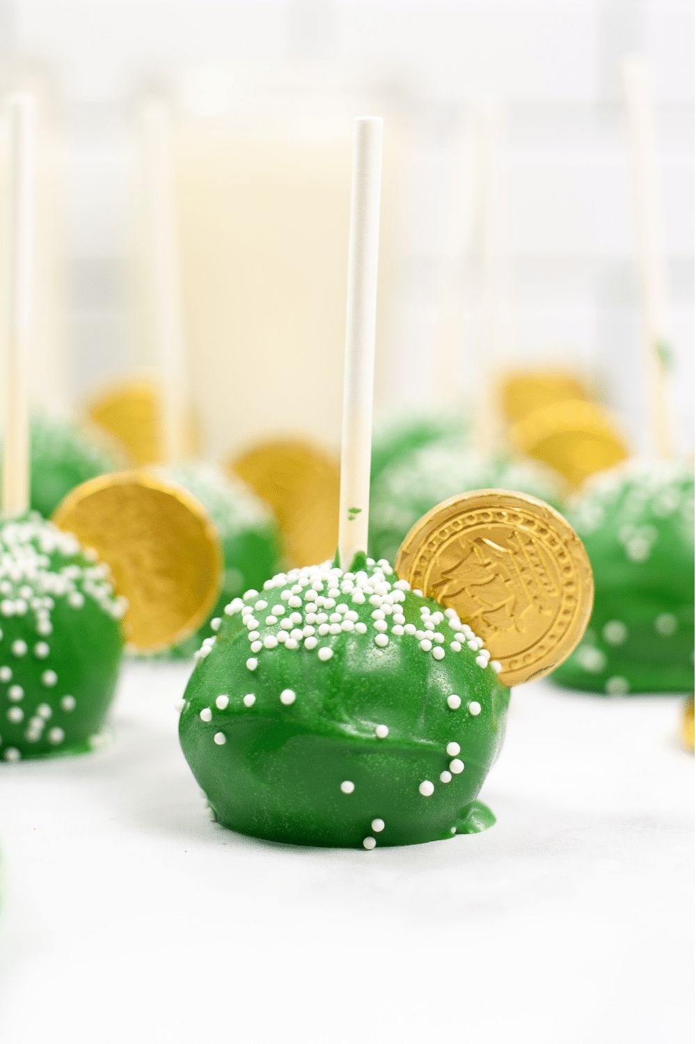 Green cake pops with gold coins