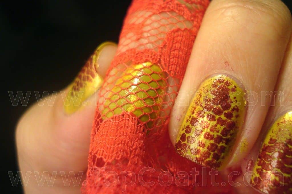 Faux snakeskin nails painted through lace
