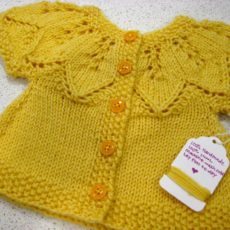 Lace yoke and seed stitch border girls' sweater