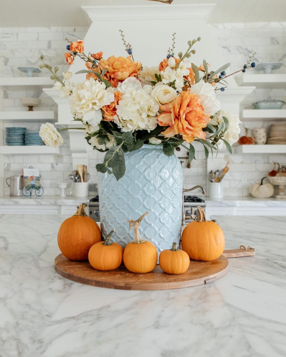 Blue and orange floral arrangement thanksgiving table centerpieces