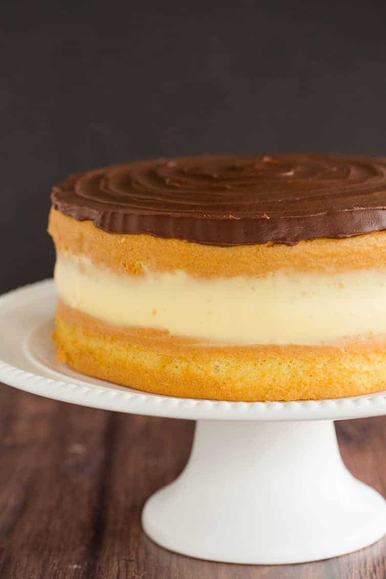 Boston cream pie cake, or vanilla cake with chocolate frosting and homemade pastry cream filling