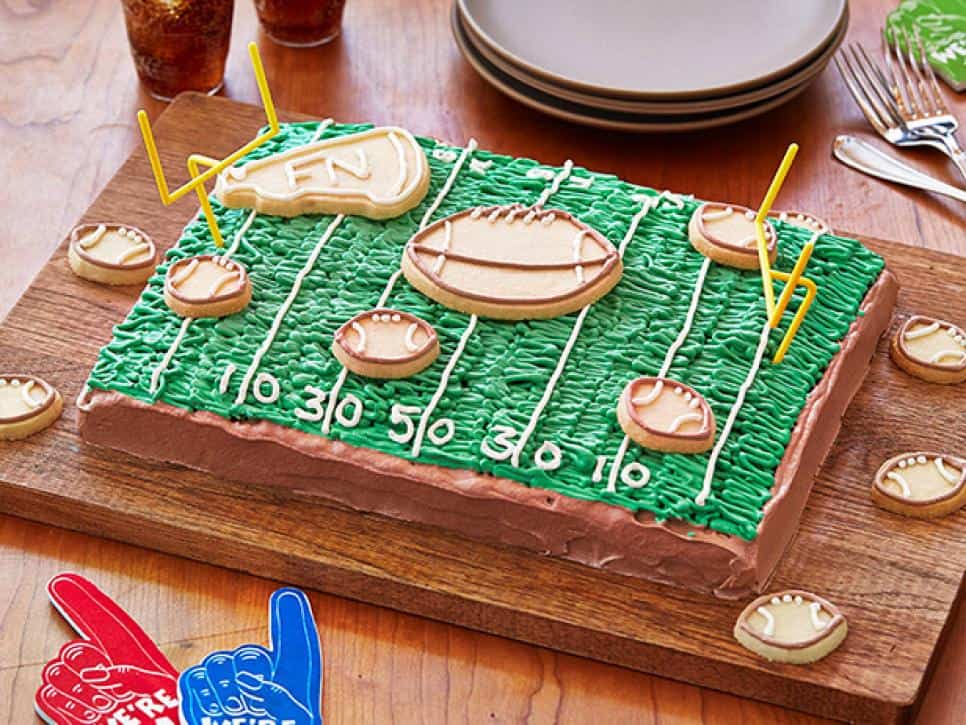 Field cake with cookie footballs on top