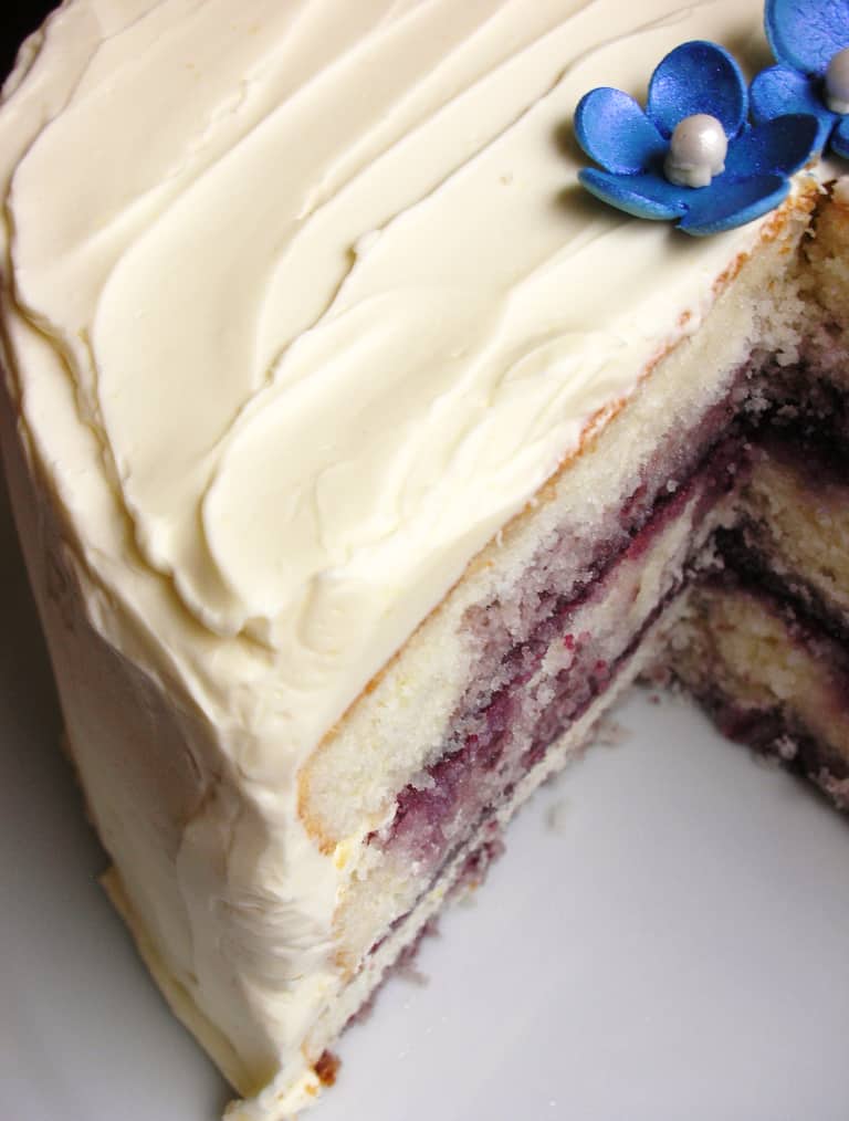 Lemon blueberry layer cake with lemon buttercream frosting and blueberry jam filling