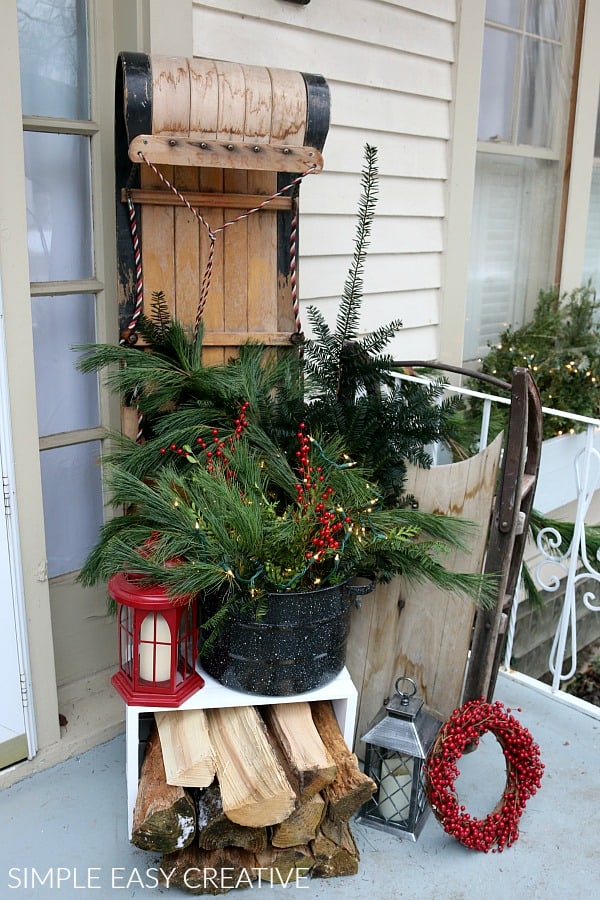 Front porch christmas decorating with sled