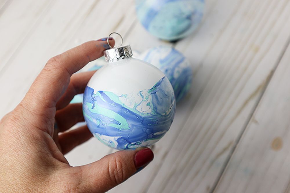 Marbled ice blue christmas decorations with nail polish 
