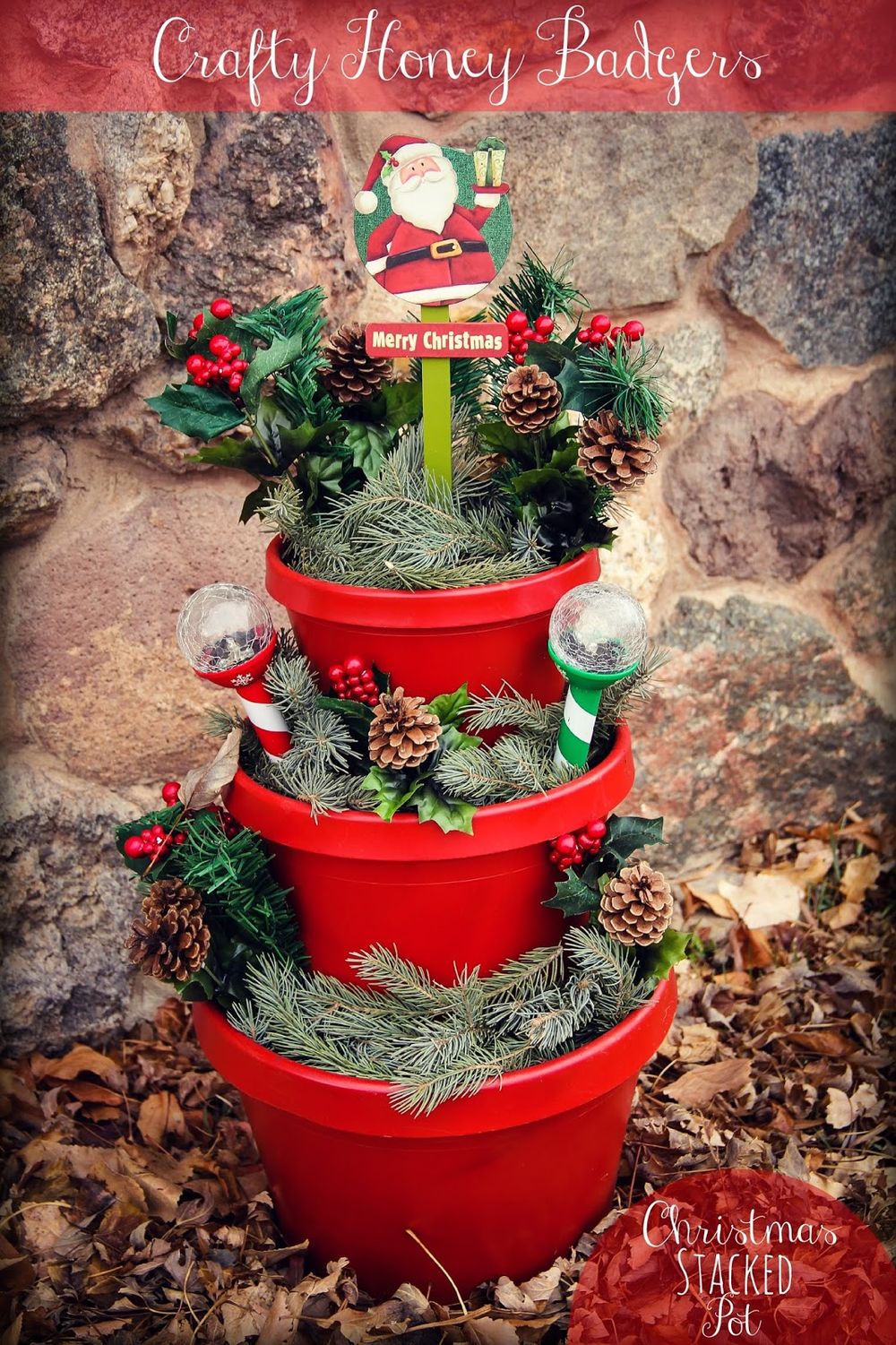 Stacked flower pots with greenery and pinecones christmas porch decorations 