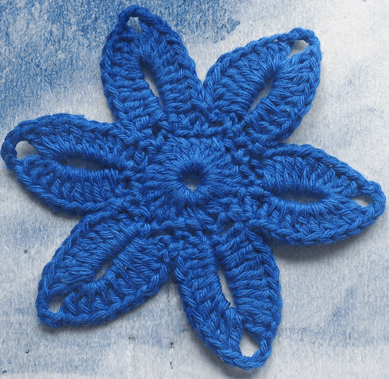 Flat crocheted flower