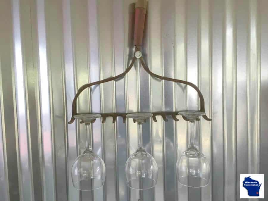 Repurposed metal rake wine glass holder