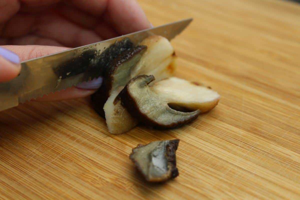 Tagliatelle with porcini mushrooms cutting the mushrooms