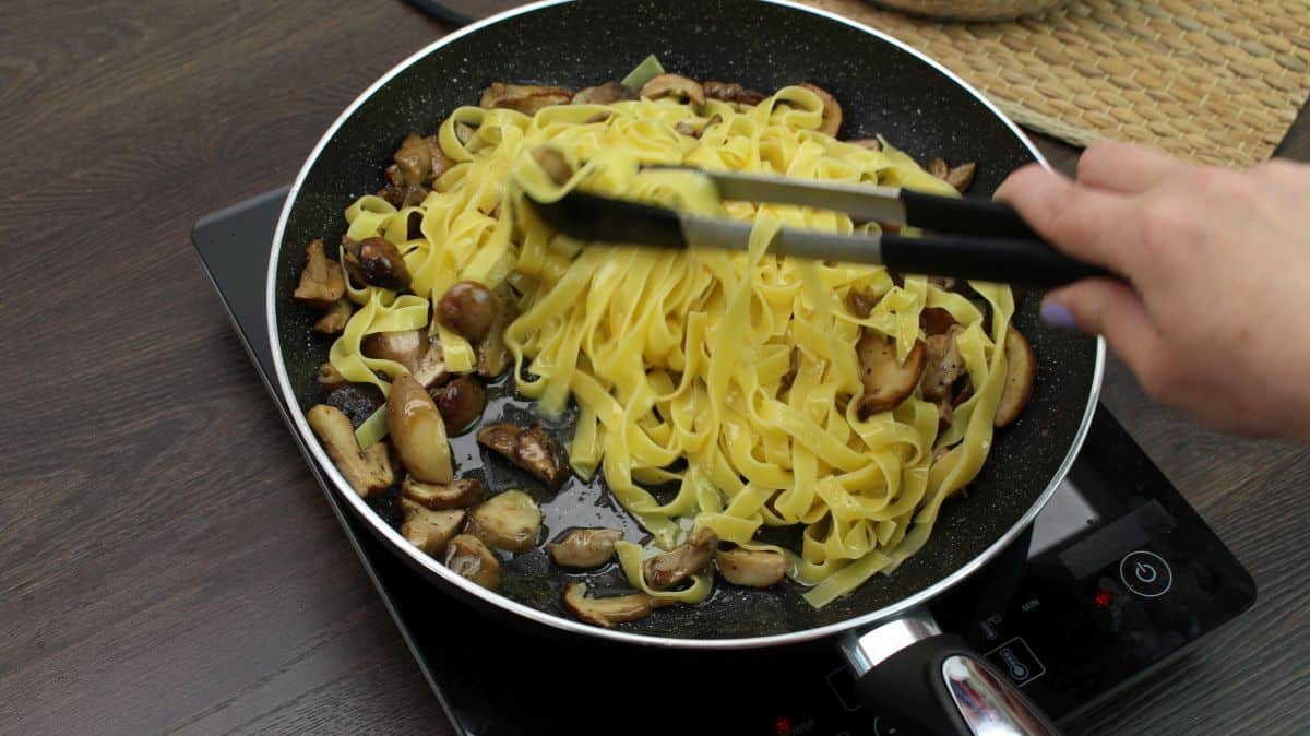 Tagliatelle with porcini mushrooms mixing