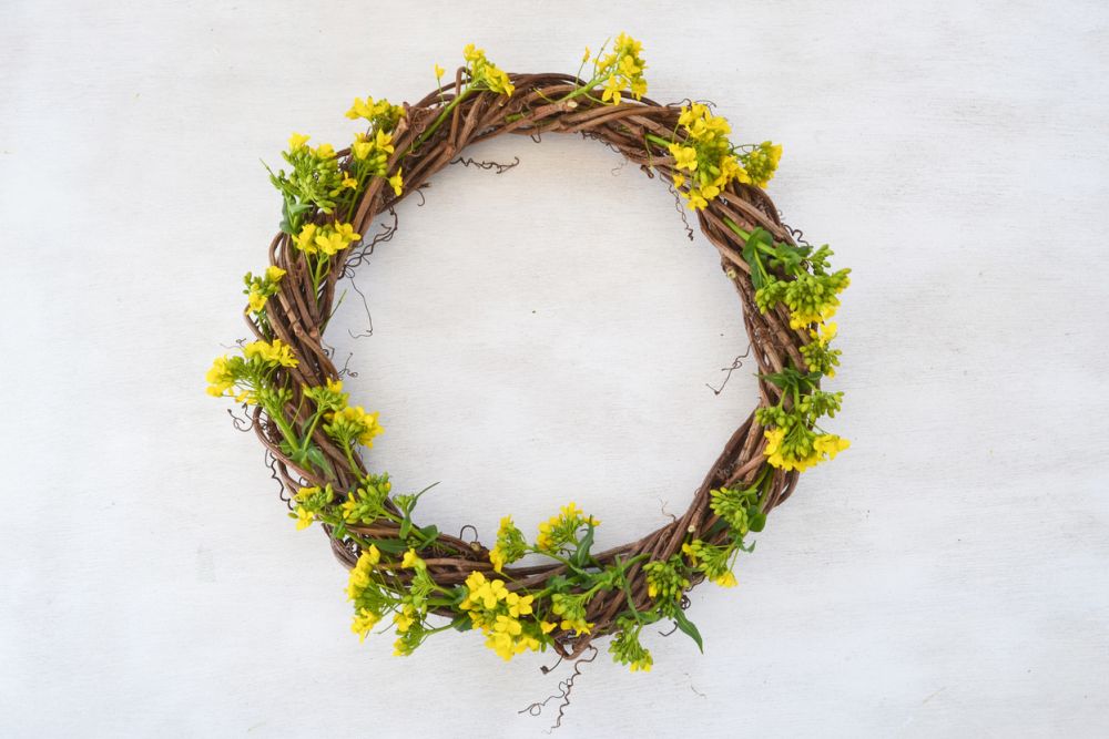 Grapevine wreath with yellow flowers