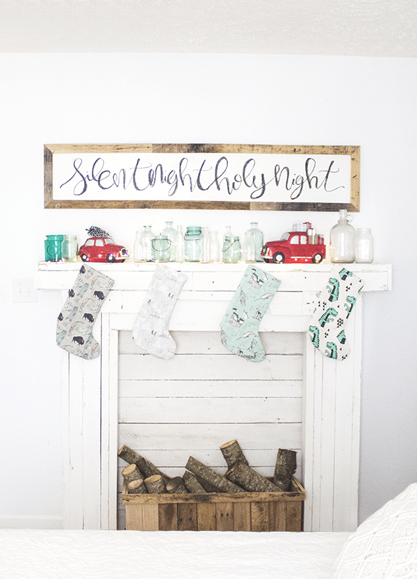 Diy rustic wood faux fireplace with a mantel