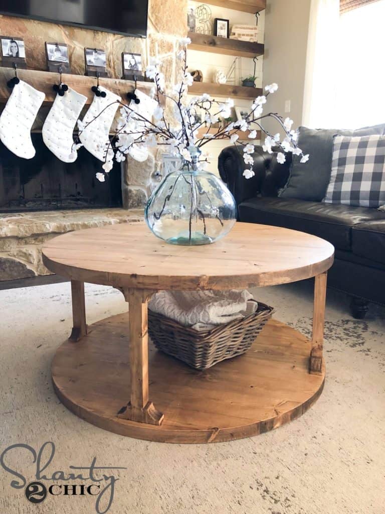 Rounded wooden coffee table with a rounded base