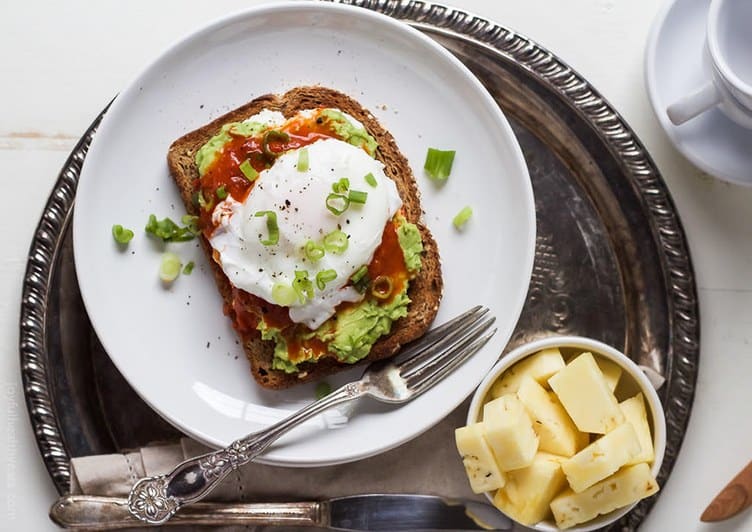 Ricotta avocado toasted with poached egg