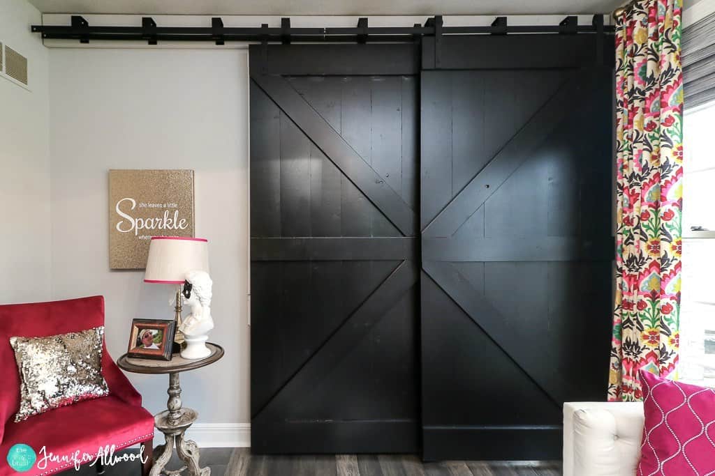 Black barn doors for a formal home office space