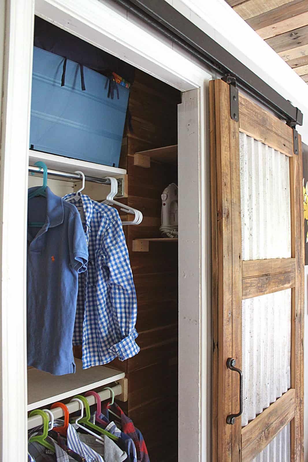 Corrugated metal and wood barn door for the closet