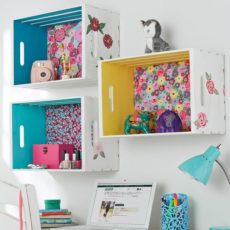 Painted and mounted crate shelves with patterned fabric backs