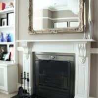 Fireplace mantel with a mirror