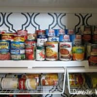 Baskets under shelves for more cans