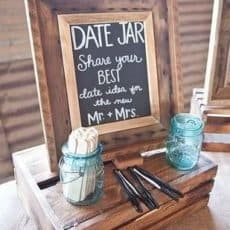Date suggestion game using popsicle sticks and a chalkboard in a frame