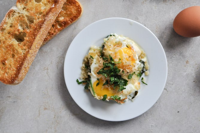 Fontina and spinach baked eggs with garlic brown butter breadcrumbs