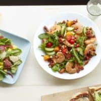 Shrimp salad with chorizo sausage and almonds